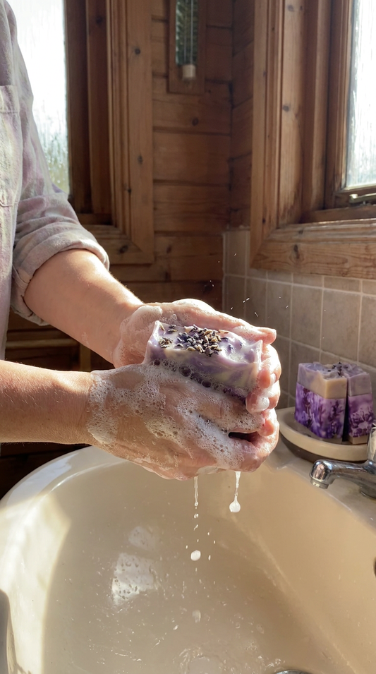 washing hands with goats milk soap